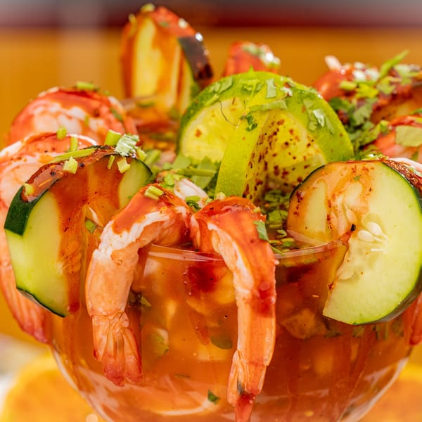 Shrimp cocktail with cucumber, lime, and cilantro in a glass at Sr. Tequila Mexican Grill.
