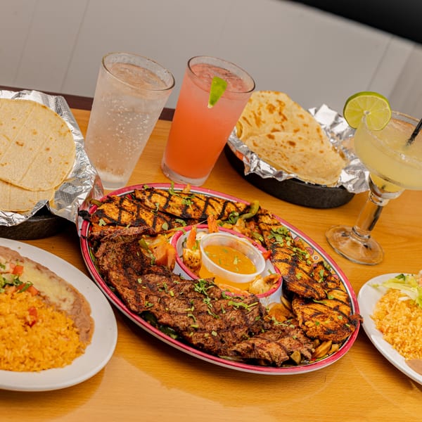 Sr. Tequila's Mexican grill with steak, chicken, shrimp, rice, beans, tortillas, and drinks.
